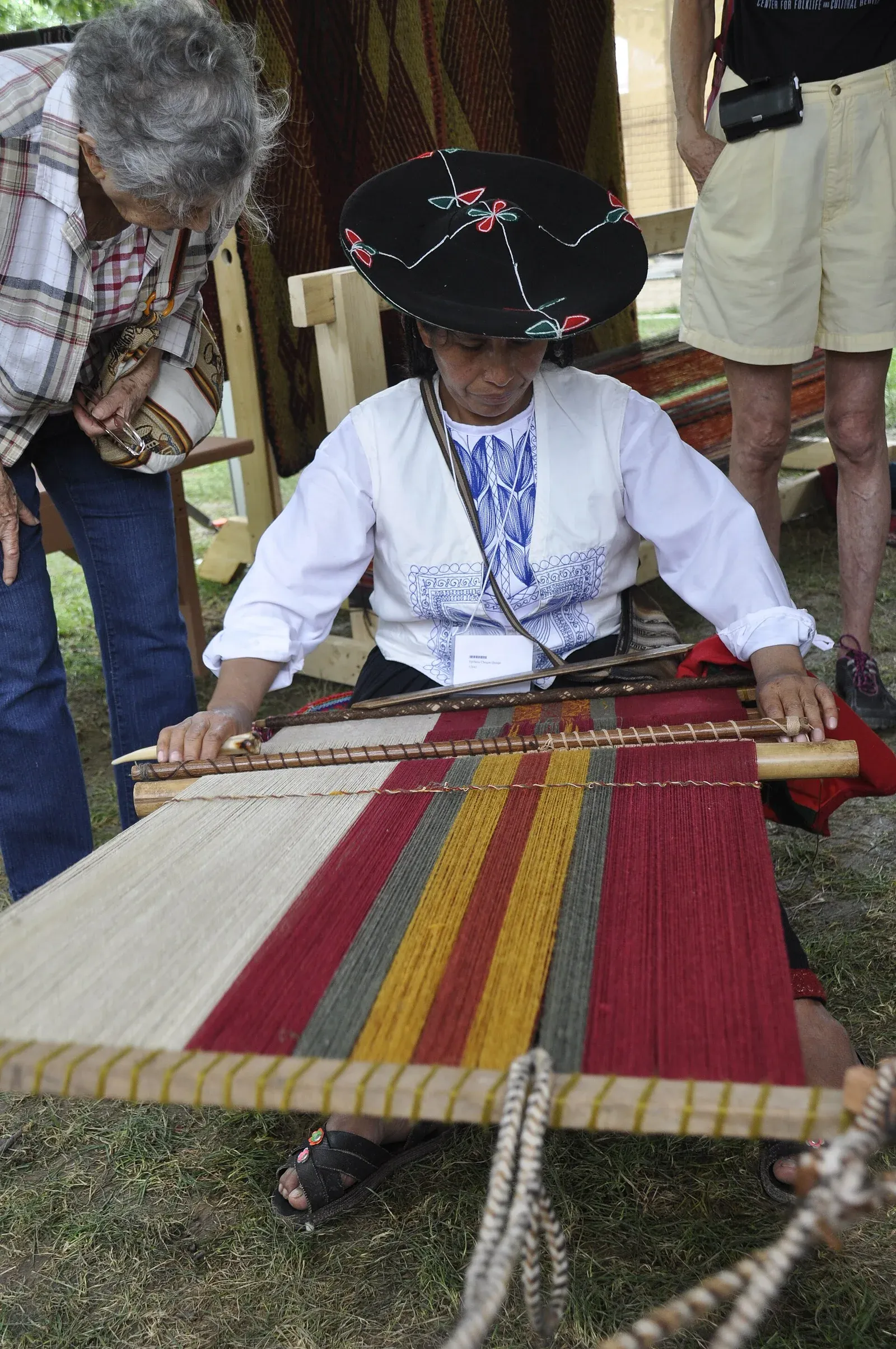 A Chinchero weaver demonstrating a loom at the 2015 Smithsonian Folklife Festival